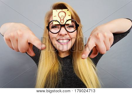 Woman Having Light Bulb Mark On Forehead Thinking