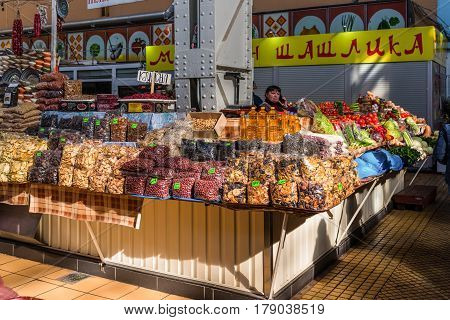 Kyiv Ukraine - March 29 2017: Display with dry fruits seeds sunflower oil and vegetables at Besarabsky market one of the iconic markets of Kyiv Ukraine.
