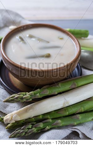 Spring season - fresh white and green asparagus cream- oup ready to eat