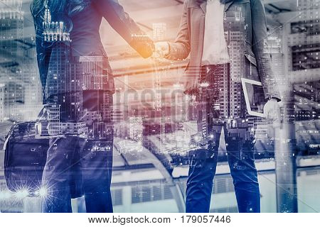 Double Exposure Businesswoman shaking hand for business successfulBusiness Concept