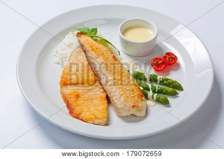 Delicious Fish Steak With Green Asparagus And Rice