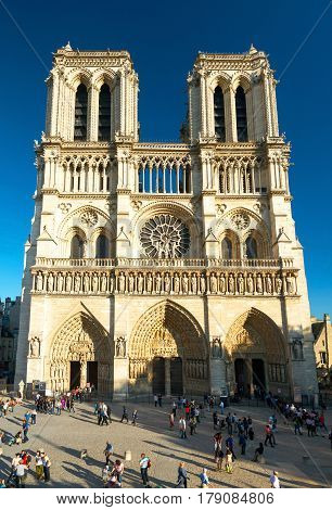 PARIS - SEPTEMBER 24: Tourists visiting the Cathedral of Notre Dame de Paris on september 24, 2013. Notre Dame is one of the top tourist destinations in Paris.