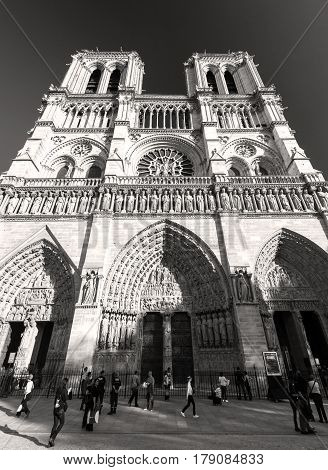 PARIS - SEPTEMBER 24: Tourists visiting the Cathedral of Notre Dame de Paris on september 24, 2013. Notre Dame is one of the top tourist destinations in Paris.