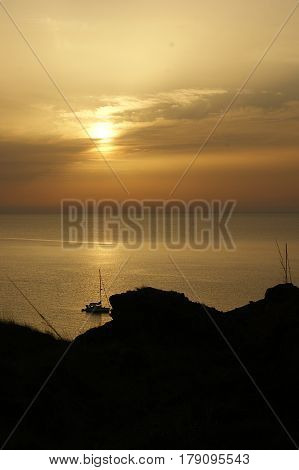 Golden sunset on the coast of Menorca in the "cap de cavalleria". Located in the northern part of the island.