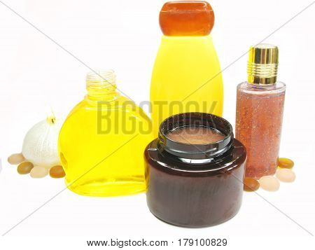 bottles of shampoo and shower gel amond candles