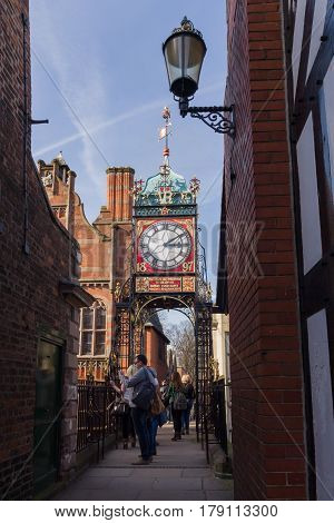 Chester England UK - March 25 2017: The ornate wrought iron Eastgate Clock over Chester's east gate a prominent city landmark built to celebrate the diamond jubilee of Queen Victoria in 1897