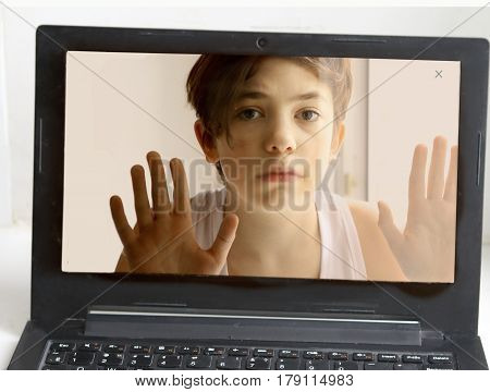 Teenager Boy Behind Computer Monitor Screen
