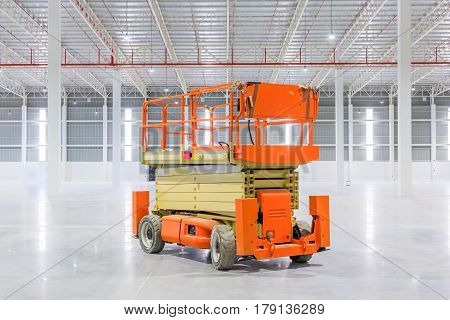 Scissor Lift Aerial Work Platform at a construction site.