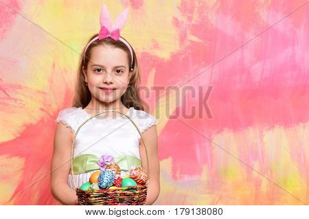 Small Happy Baby Girl Holding Pottle With Easter Eggs