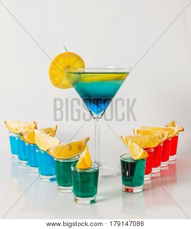 Eleven Color Shot Drinks, Red, Blue And Green Kamikaze, Drink In Martini Glass, Quarters Of Lemon