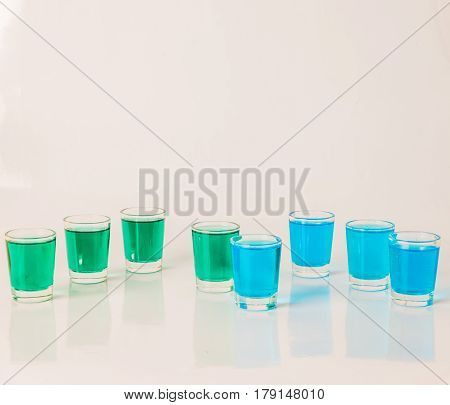 Glasses With Blue And Green Kamikaze, Glamorous Drinks, Mixed Drink Poured Into Shot Glasses