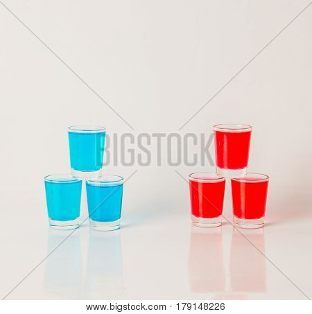 Glasses With Blue And Red Kamikaze, Glamorous Drinks, Mixed Drink Poured Into Shot Glasses