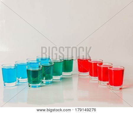 Glasses With Blue, Green And Red Kamikaze, Glamorous Drinks, Mixed Drink Poured Into Shot Glasses