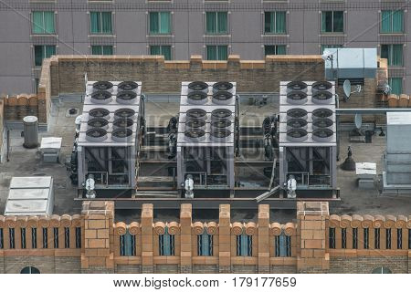 Air Conditioner ventilation system on building rooftop. Aerial view to AC system on skyscraper.
