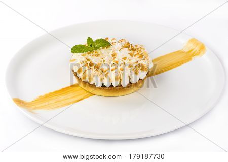 Dessert basket with berries adorned with cream and mint on a plate