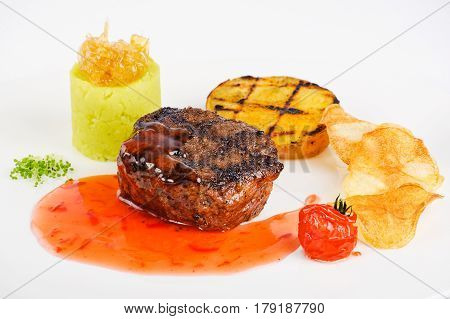 Steak with sweet and sour sauce and three kinds of potatoes