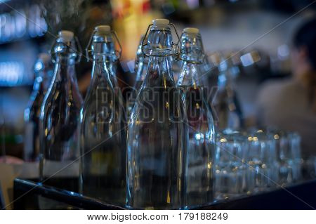 A display of various empty glass bottles