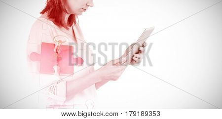 Businesswoman looking at tablet against grey background 3d
