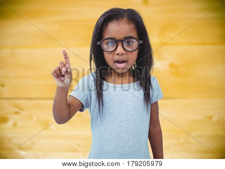 Digital composite of Girl in glasses against yellow wood panel