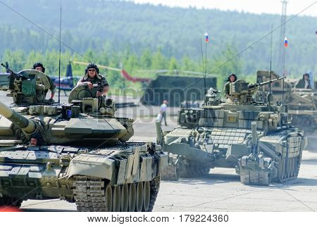 Nizhniy Tagil, Russia - July 12. 2008: Modernized tank T-72, BMR-3M armoured deminer and guard move on shooting demonstration range. RAE-2008 exhibition