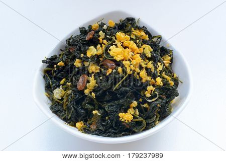 Chinese Traditional Food, Stir Fried Jute Leaves or Mulukhiyah Leaves with Garlics and Fermented Soy Bean.