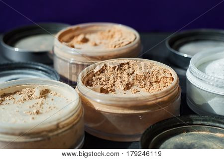 Beige make-up powder for matt foundation. Mineral powder of nude colors selective focus