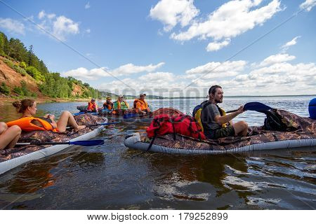 Canoeing on the Kama river, Doksha district, Russia - 07.06.2014: Editorial. Group of canoers