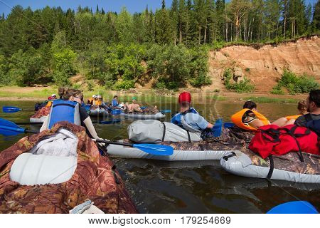Canoeing on the Kama river, Doksha district, Russia - 07.06.2014: Editorial. Group of canoers
