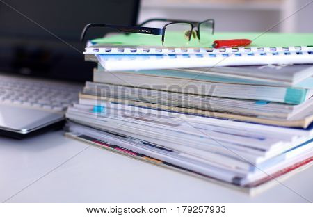 Group Of Multicolored Office Folders And Glasses