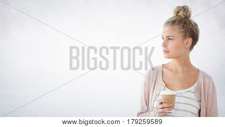 Digital composite of Woman looking to the side coffee cup against white wall
