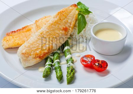 Delicious Fish Steak With Green Asparagus And Rice