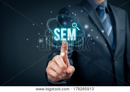 Search engine marketing - SEM concept. Businessman or programmer is focused to improve SEM and web traffic.
