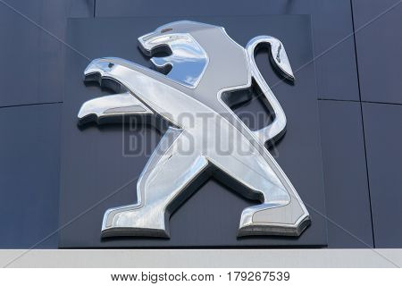 Villefranche, France- March 5, 2017: Peugeot logo on a wall. Peugeot is a French cars brand, part of peugeot Citroen automobile group