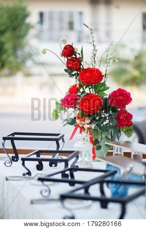Batch of red carnation flower in glass jar