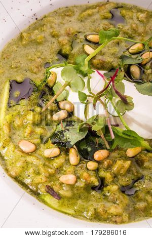 Orzotto with goat cheese and spinach with pine nuts