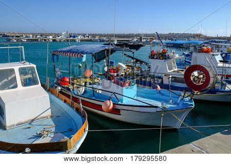 Fishing boats moored at the marina in the fishing village of Zygi in Cyprus.  Taken in spring on a bright sunnny day.
