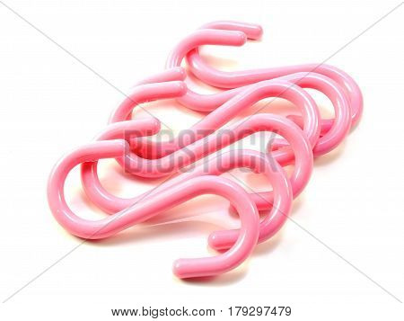pink s-shape hooks isolated on white background