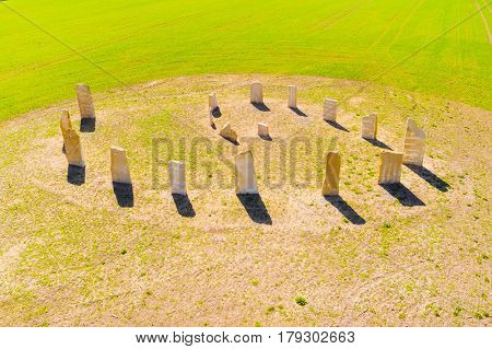 Aerial view of ancient esoteric geomancy symbol in green wheat field. Mystery of Czech countryside. Spring landscape near Pilsen. Czech Republic, Central Europe.