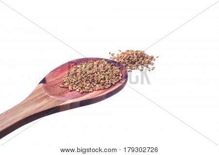 Fenugreek Seeds On A Brass Spoon Isolated On A White Background.