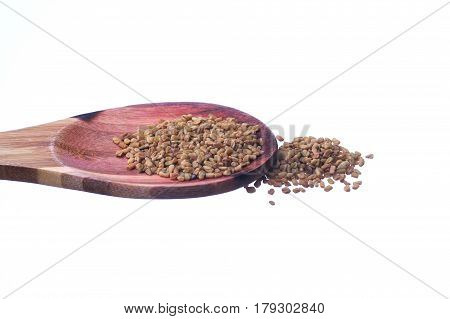 Fenugreek Seeds On A Brass Spoon Isolated On A White Background.