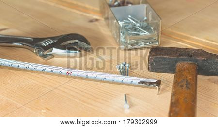 Set Of Tools On A Workbench With Nails