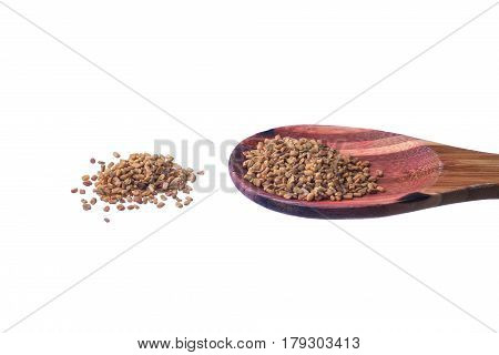 Fenugreek Seeds On A Brass Spoon Isolated On A White Background.