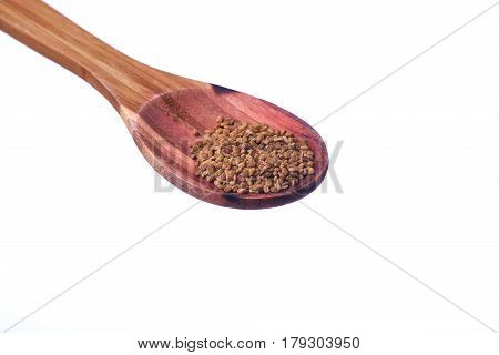 Fenugreek Seeds On A Brass Spoon Isolated On A White Background.