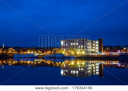 The Night Landscape On The River In Hamelin,germany