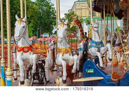 Beautiful horse on the carousel street. Carnival