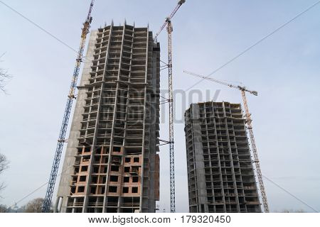 Constraction site with crain and the new building