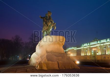 SAINT PETERSBURG, RUSSIA - MARCH 12, 2017: The monument to Peter the Great (bronze horseman) on the Senate square on a foggy March night. Saint Petersburg, Russia