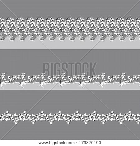 set of ribbons embroidered cutwork on a gray background