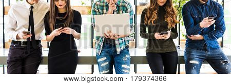 Cropped Photo Of Group Of Friends Standing On Table And Everyone Use His Divices In Modern Office Ro