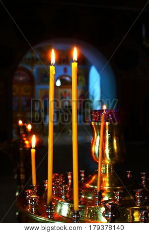Church candles on the Golden candlestick in the temple